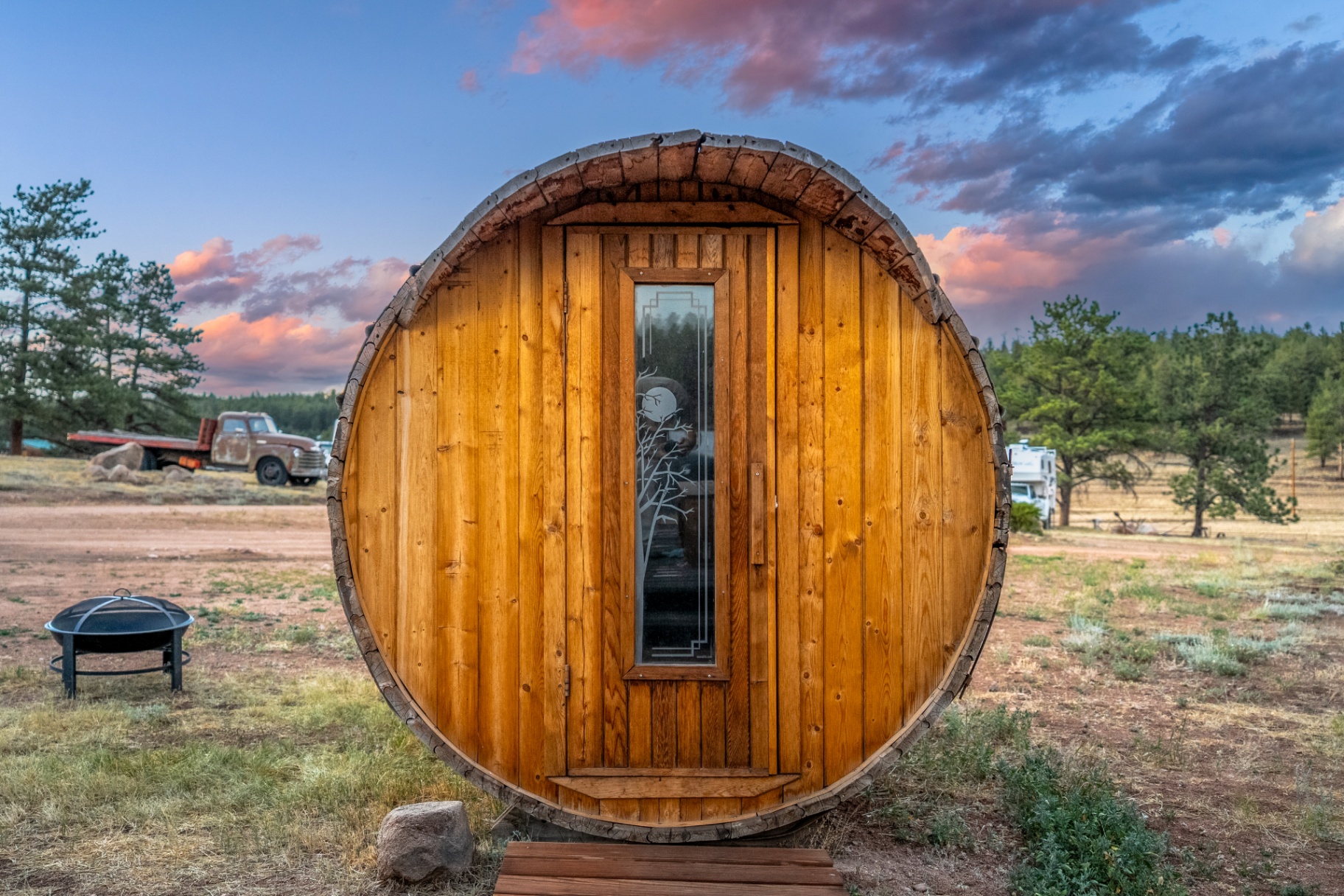 Wooden barrel sauna at sunset on M Lazy C Ranch
