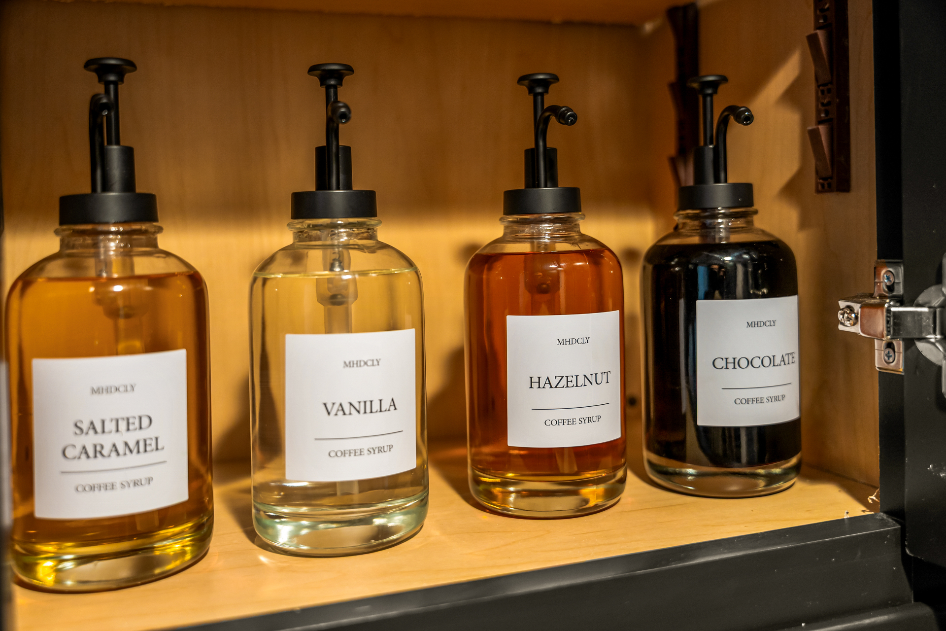 Coffee syrups arranged in the tiny house coffee station